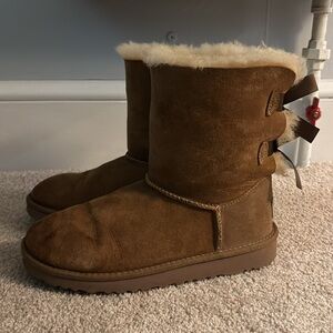 Only worn once. Some spots on uggs due to age and sitting in my closet.